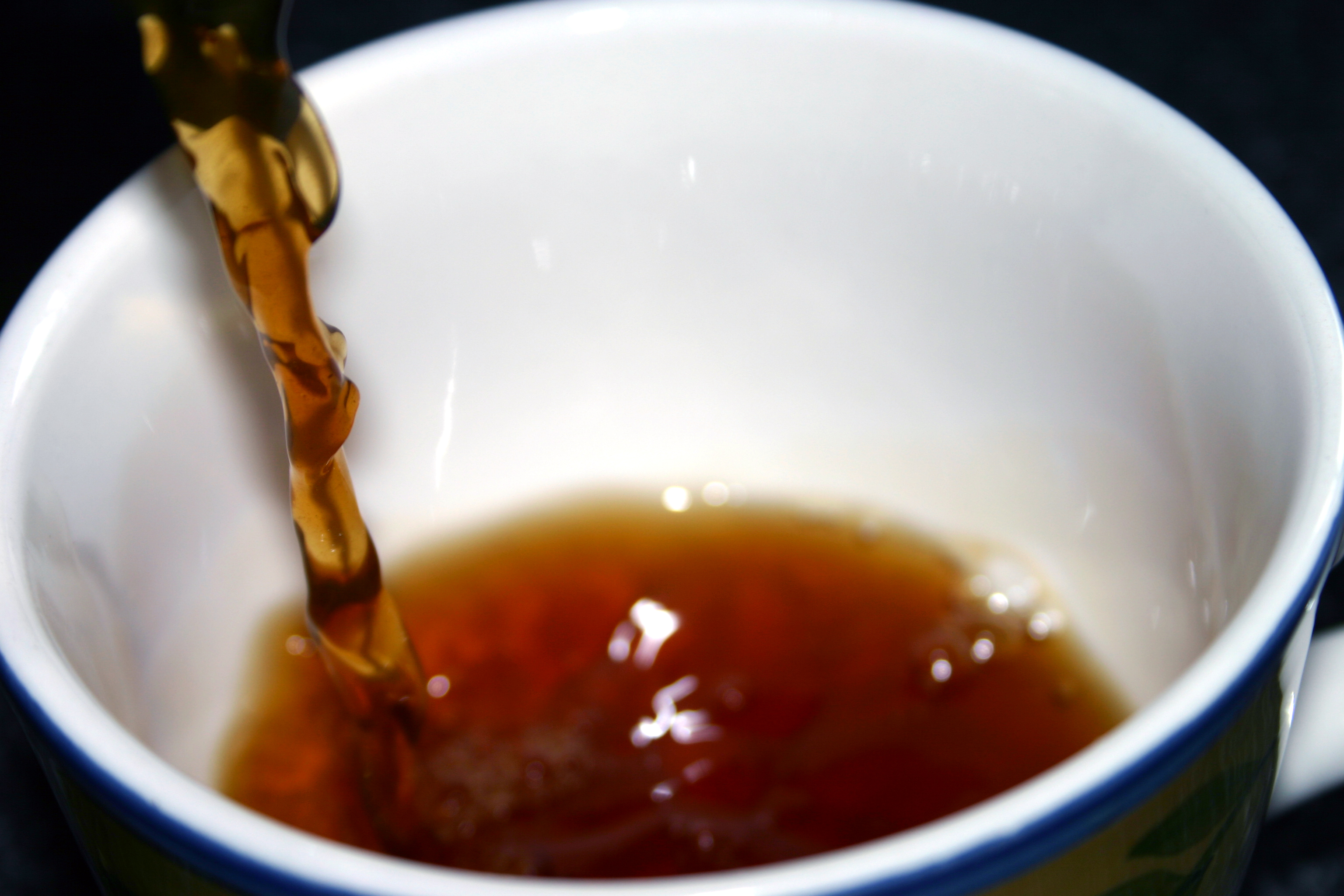 Tea Pouring Into Cup